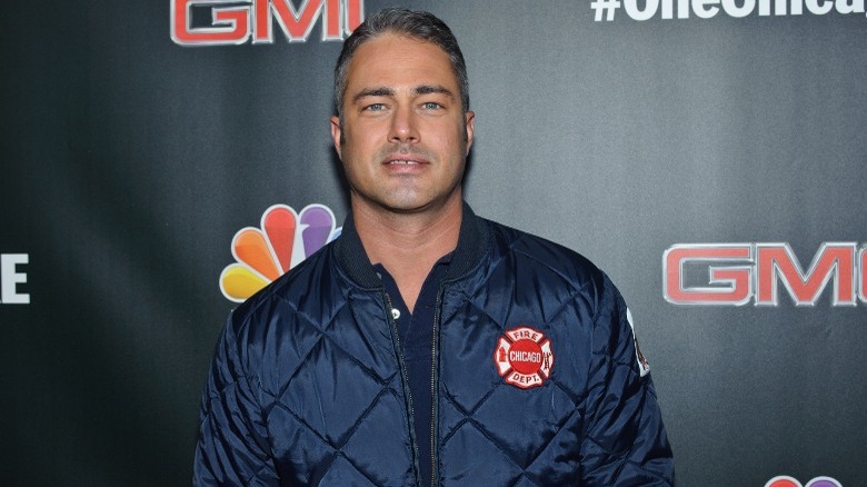 Taylor Kinney navy bomber jacket 