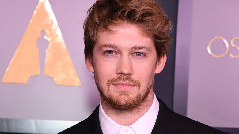 Joe Alwyn wearing a suit