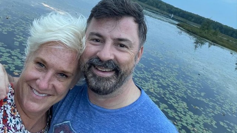 Anne Burrell and Stuart Claxton smiling for selfie