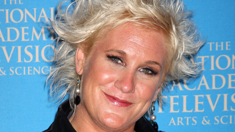 Anne Burrell tilting head and smiling