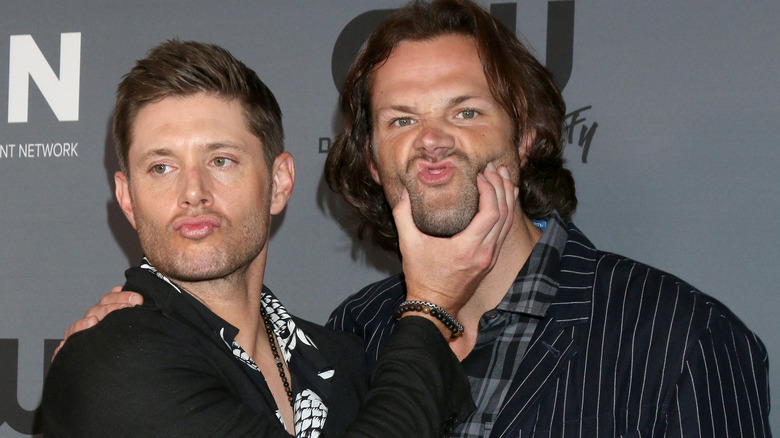 Jensen Ackles holding Jared Padalecki's face