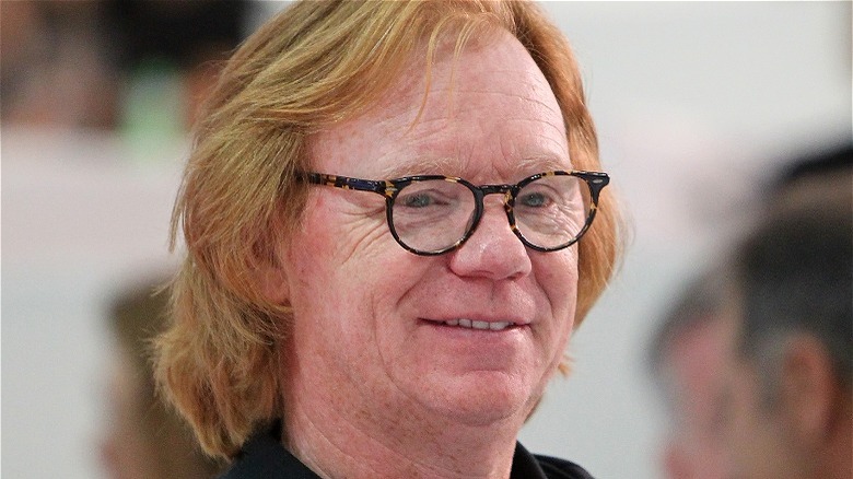 Long-haired David Caruso smiling