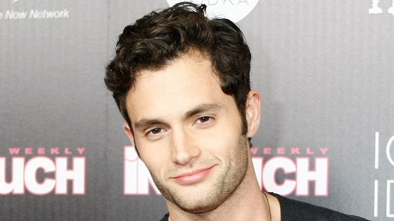 Penn Badgley at an event, smiling