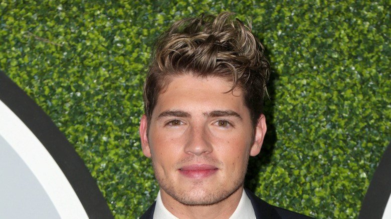 Gregg Sulkin smiling