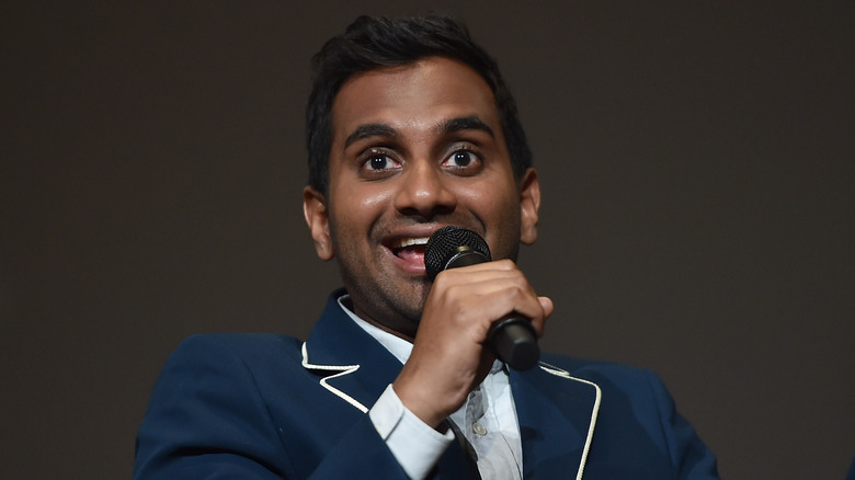 Aziz Ansari smiling