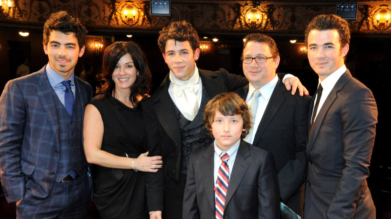 The Jonas Brothers with their parents