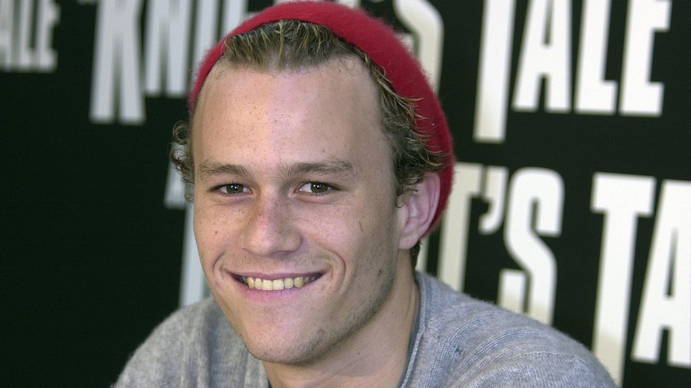 Heath Ledger with a red hat, smiling