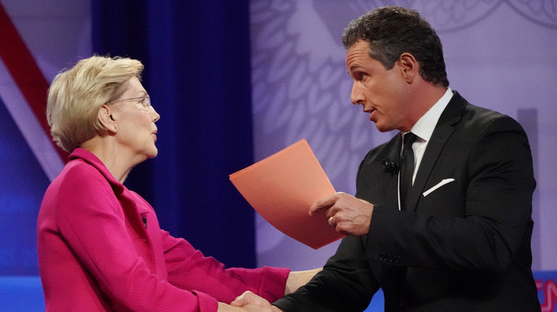 Sen. Elizabeth Warren shakes hands with CNN moderator Chris Cuomo at the Human Rights Campaign Foundation 2019