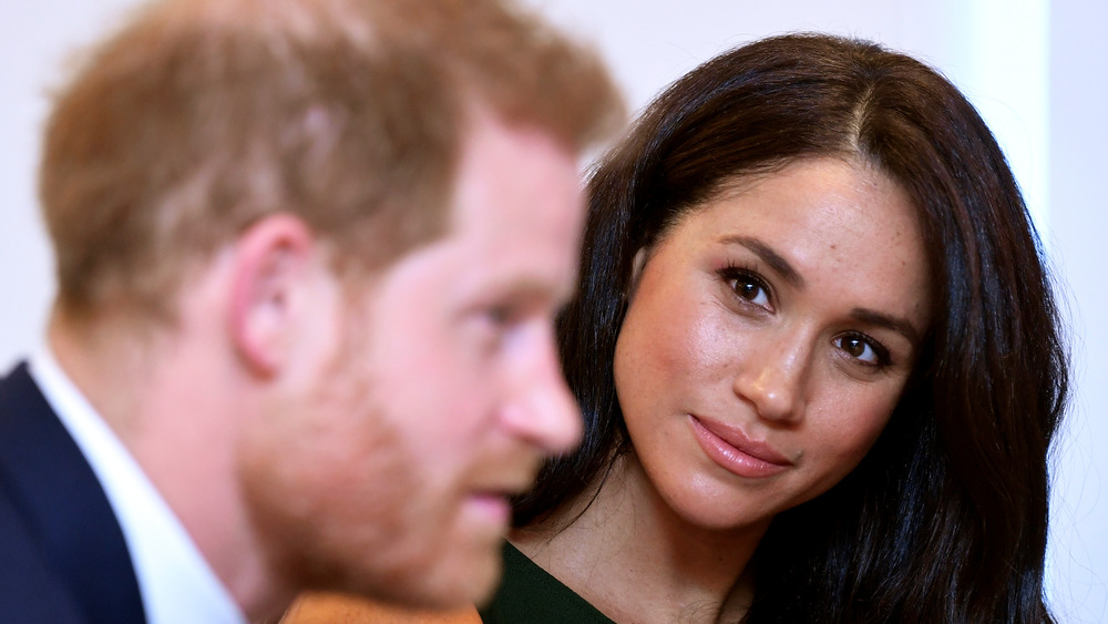 Meghan Markle looking at Prince Harry