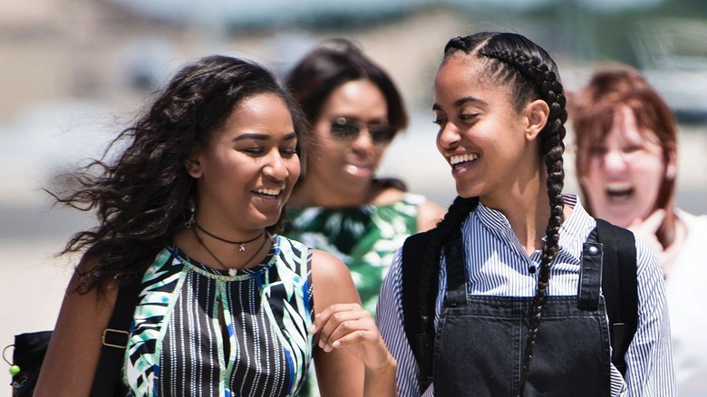 Sasha and Malia Obama walk off Air Force One