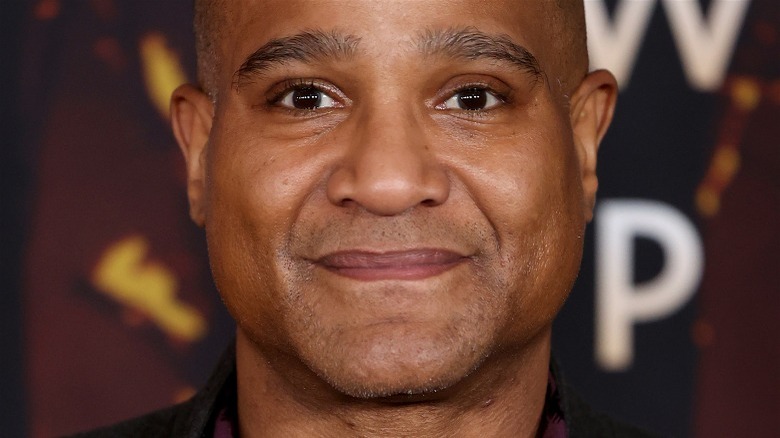 Seth Gilliam smiling red background