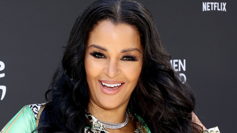 Claudia Jordan smiling on red carpet