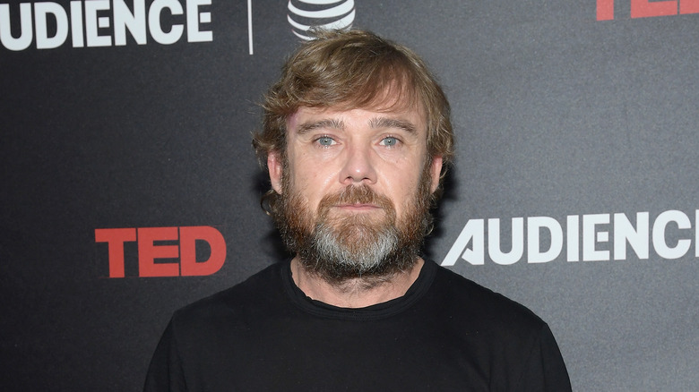 Rick Schroder posing on red carpet