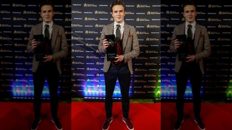 Karsten Warholm holds an award