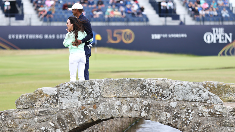 Erica Herman and Tiger Woods embracing