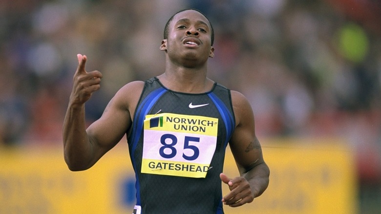 Tim Montgomery gestures during race