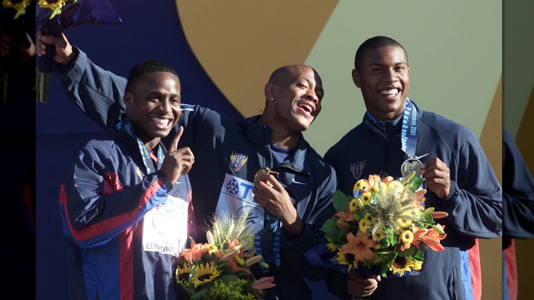 Tim Montgomery and other athletes celebrating