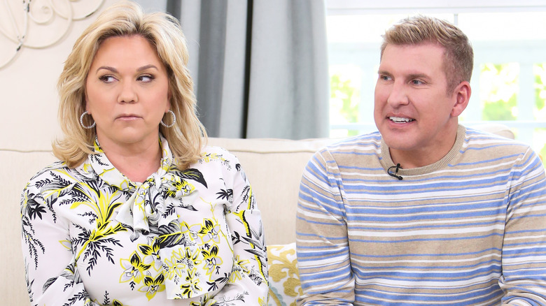 Julie Chrisley looking to the side and Todd Chrisley smiling