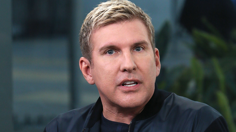 Todd Chrisley black jacket