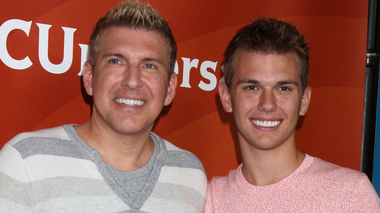 Todd and Chase Chrisley pose 