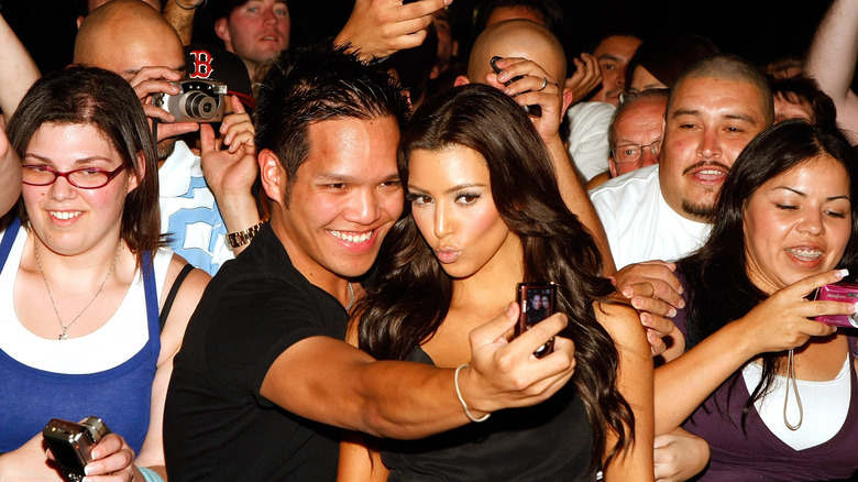 Kim Kardashian takes selfie with fan