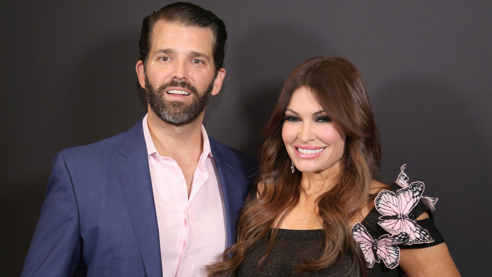 Donald Trump Jr. and Kimberly Guilfoyle smiling 