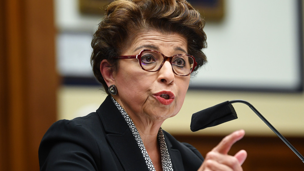 Jovita Carranza speaking into a microphone 