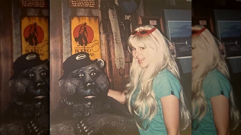 Brandi Passante with wooden bear