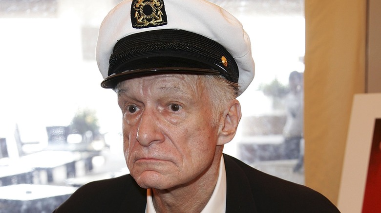 Hugh Hefner in a captains hat