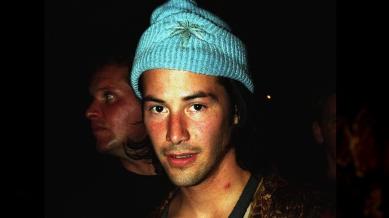 Keanu Reeves wearing blue beanie