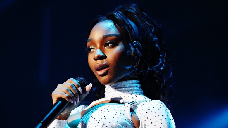 Normani signing on stage