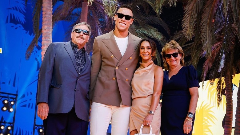 Aaron Judge posing with parents and wife