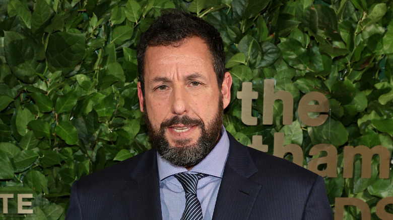 Adam Sandler wearing a suit