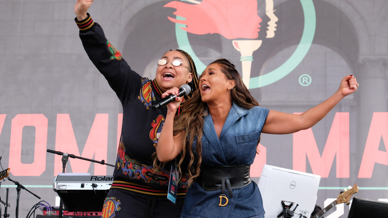 Adrienne Bailon and Raven Symoné performing on stage