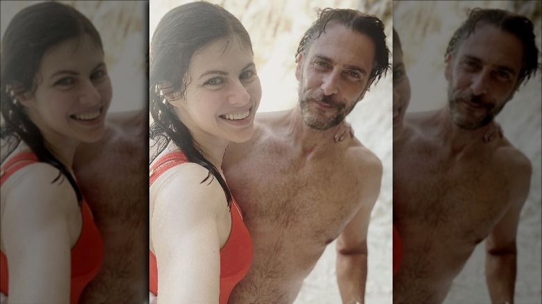 Alexandra Daddario and Andrew Form smiling while wet