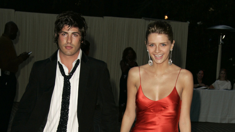 Brandos Davis walks with Mischa Barton