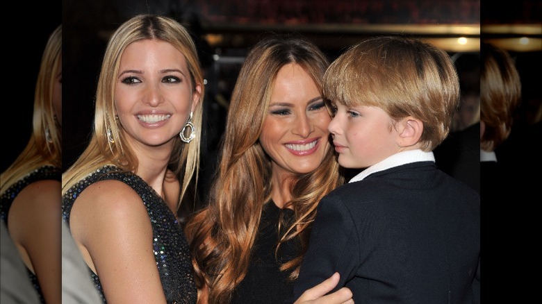 Ivanka Trump smiling next to Melania and Barron