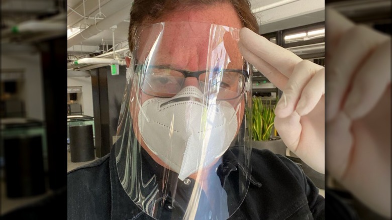 Bob Saget wearing a mask and face shield