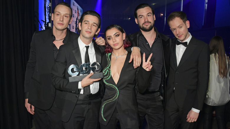 Charli XCX and The 1975 posing together