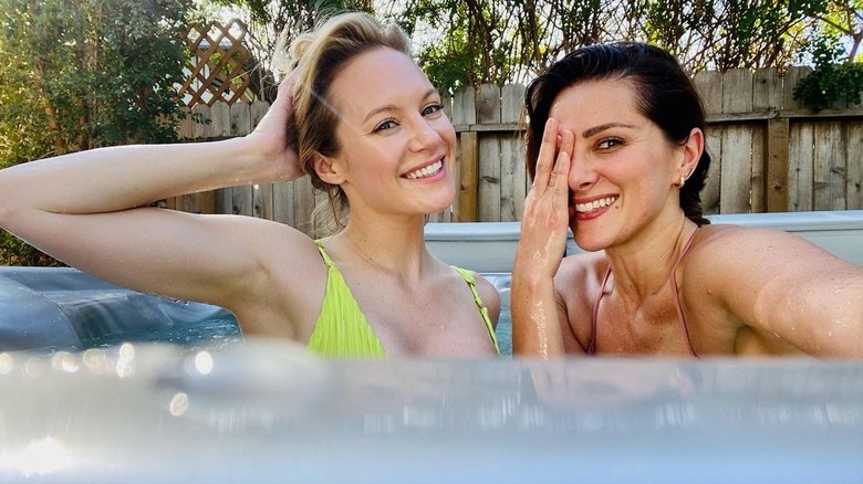 Danielle Savre, Stefania Spampinato posing in pool