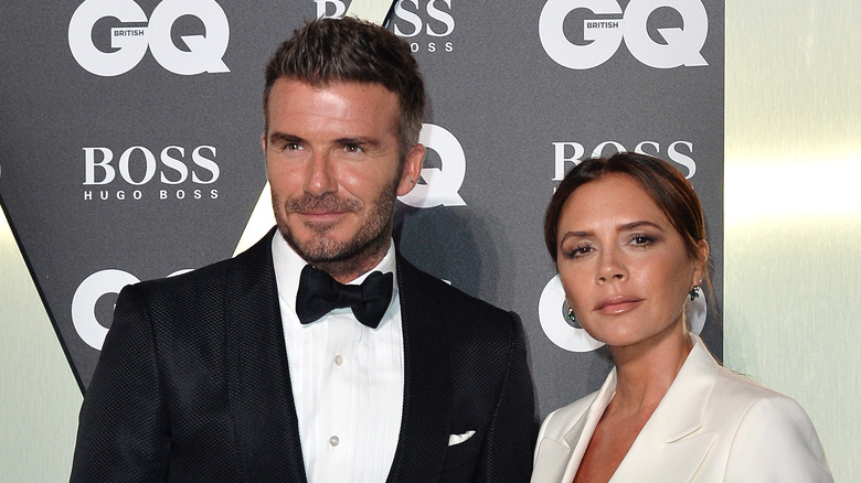 David Beckham and Victoria Beckham posing together