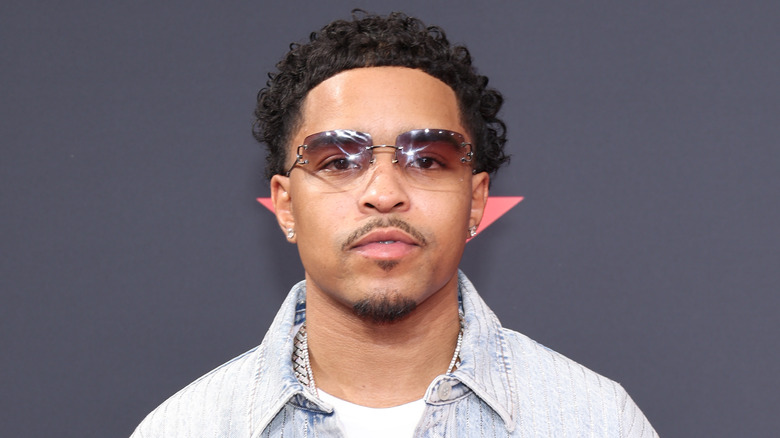 Justin Dior Combs posing with sunglasses on