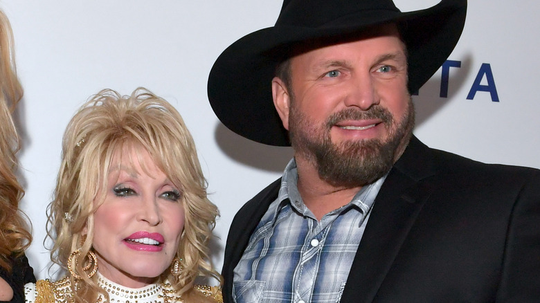 Dolly Parton and Garth Brooks smiling