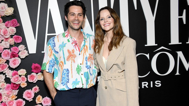 Dylan O'Brien and Sarah Ramos posing together, both smiling