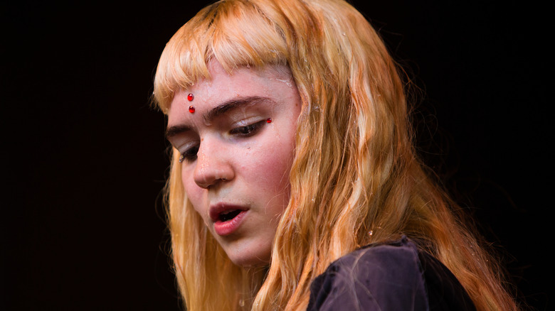 Grimes performing onstage