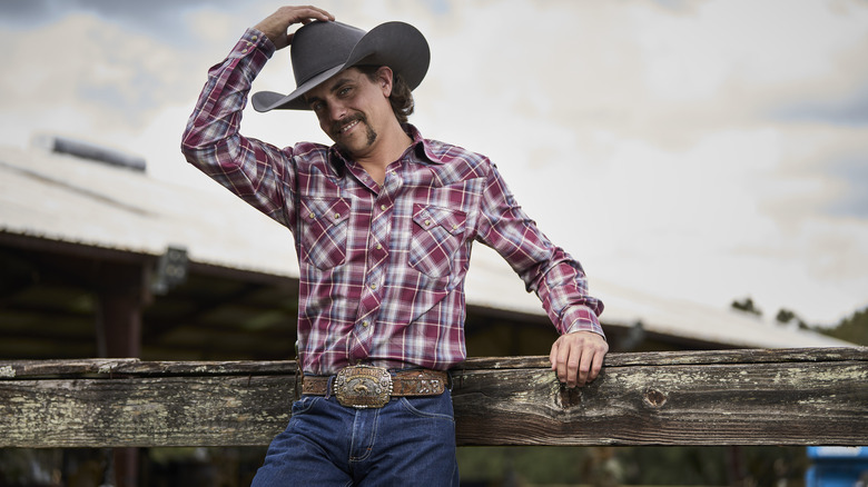 Farmer Allen Foster tipping his cowboy hat