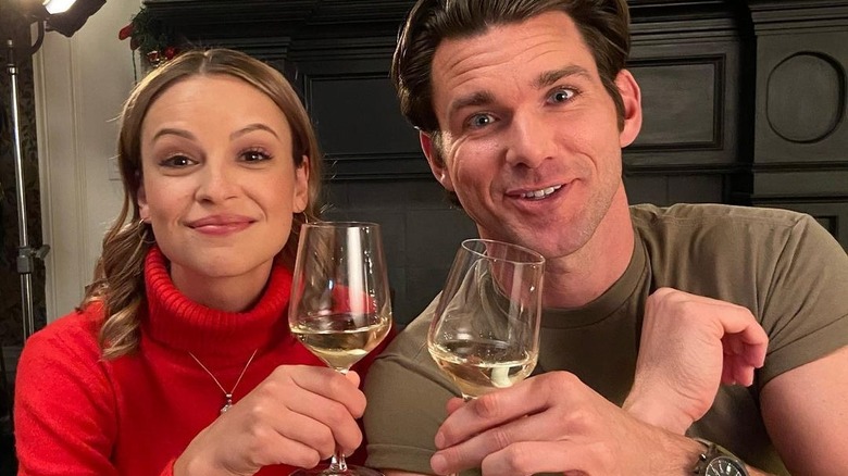 Kevin McGarry and Kayla Wallace drinking wine