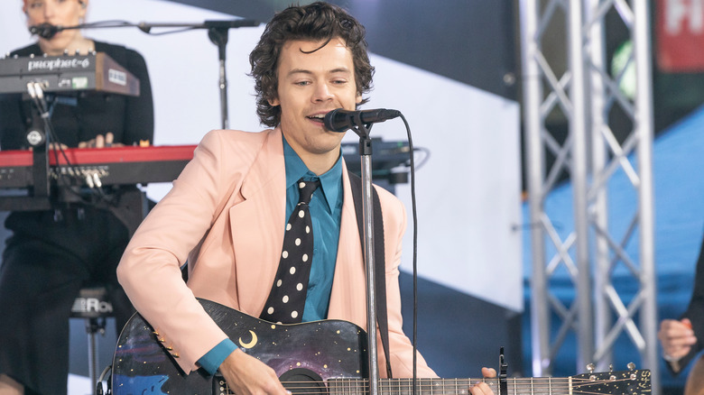 Harry Styles performing on stage