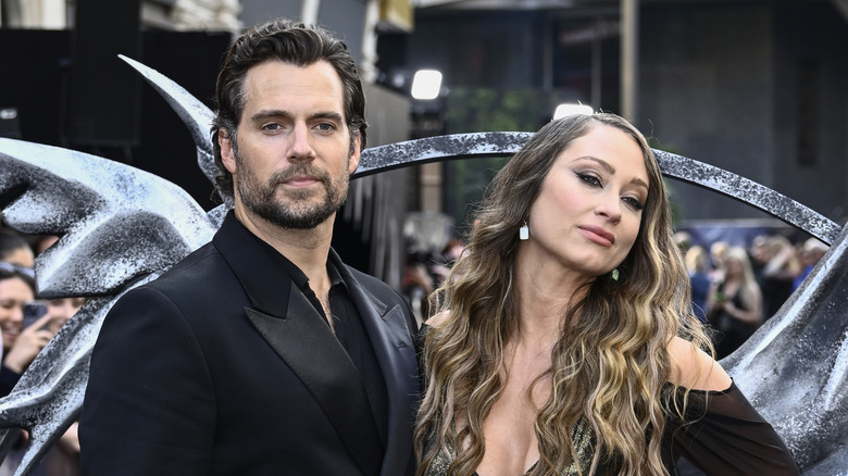 Henry Cavill black tux and Natalie Viscuso wavy hair