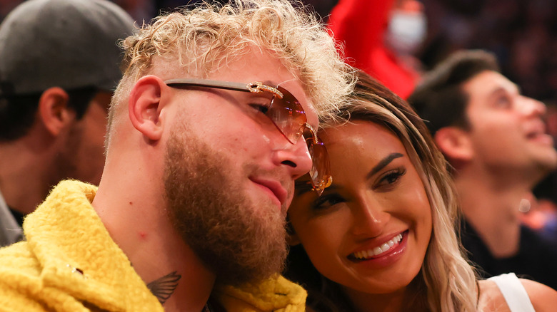 Jake Paul and Julia Rose at a basketball game 